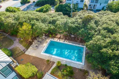 an overhead view of a swimming pool in a yard with trees at Inlet Dunes 204 l Community Pool l Across From The Beach in Inlet Beach
