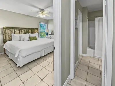 a bedroom with a bed and a ceiling fan at Inlet Dunes 204 l Community Pool l Across From The Beach in Inlet Beach