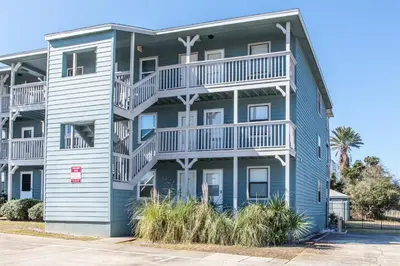 a large blue apartment building with white balconies at Inlet Sands 204 l 1 min walk to beach l Community Pool l Bike to Rosemary in Inlet Beach