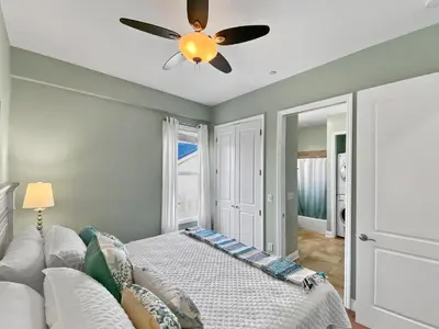 a bedroom with a bed and a ceiling fan at Leeward 1 7 l Beachfront Condo with Stunning Views of the Water l Bike to Seaside in Seagrove Beach
