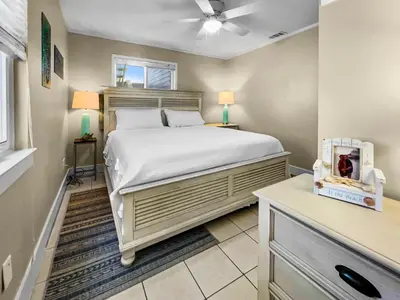 a bedroom with a large bed in a room at Leeward II 3 l Beachfront Condo l Large first level deck with steps down to sand in Seagrove Beach