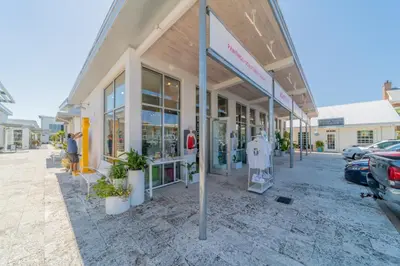 a store front with plants in front of it at Leeward II 8 Sand Angels l Beachfront Condo l Newly Renovated l Beach Towels in Seagrove Beach