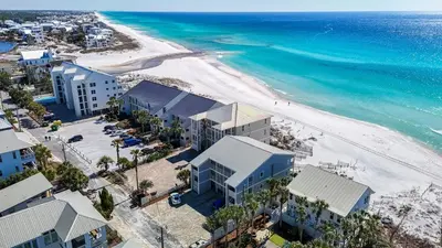 an aerial view of a beach with buildings and the ocean at Leeward II 8 Sand Angels l Beachfront Condo l Newly Renovated l Beach Towels in Seagrove Beach