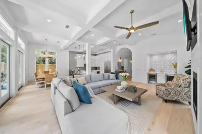 a living room with a couch and a table at Magnolia Tides l 6 Bedroom l Private Pool l South of 30A l Santa Rosa Beach in Santa Rosa Beach