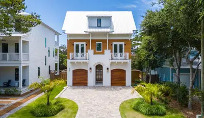 a large white house with a white roof at Magnolia Tides l 6 Bedroom l Private Pool l South of 30A l Santa Rosa Beach in Santa Rosa Beach