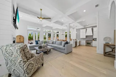 a living room with a couch and a table at Magnolia Tides l 6 Bedroom l Private Pool l South of 30A l Santa Rosa Beach in Santa Rosa Beach