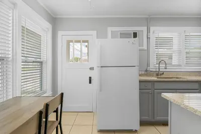 a white refrigerator in a kitchen with a counter at 19224 Delmar Dr in Panama City Beach