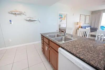 a kitchen with a sink and a counter top at Splash 1701E - 2BD in Panama City Beach