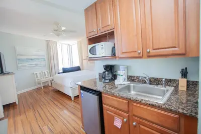 a kitchen with a sink and a counter top at Splash 1701E - Studio in Panama City Beach