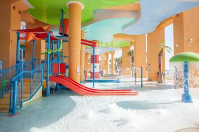 a water park with a slide in a building at Splash 504E in Panama City Beach