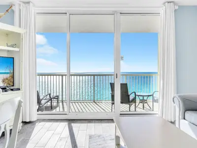 a living room with a view of the ocean at Majestic Beach Towers One 1314 by Emerald Coast Retreats in Panama City Beach