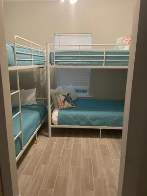 a bunk bed room with two bunk beds in it at Livin Laguna Loca in Panama City Beach