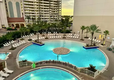 an overhead view of a large swimming pool in a building at 3 BD Gulf View Resort Condo! 5 Pools! Beach Access by Dolce Vita Getaways in Panama City Beach