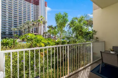a balcony with a view of a resort at Shores of Panama Ground Floor Unit 108! No elevators needed and convenient same-floor parking! in Panama City Beach