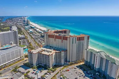 an aerial view of the beach and the ocean at Shores of Panama Ground Floor Unit 108! No elevators needed and convenient same-floor parking! in Panama City Beach