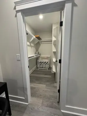 a hallway with a door leading into a room at BeaLake House in Panama City Beach