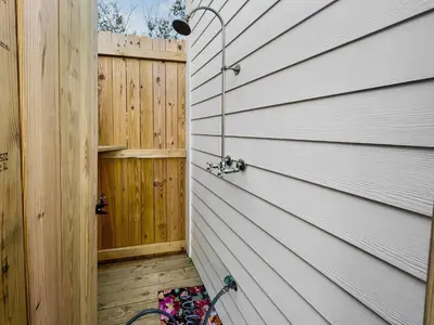 a door to a house with a fence at Sand Piper l 4 Minute Walk to the Beach l Inlet Beach in Inlet Beach