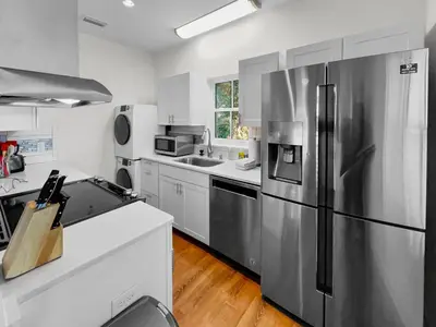 a kitchen with a stainless steel refrigerator at Sand Piper l 4 Minute Walk to the Beach l Inlet Beach in Inlet Beach