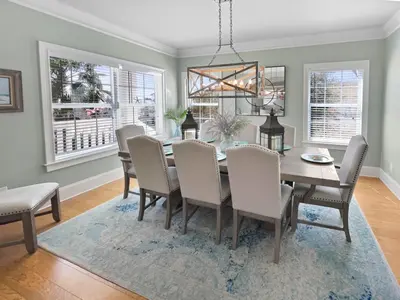 a dining room with a table and chairs at Sand Seair l Private Heated Pool l Bikes and Golf Cart included in Inlet Beach