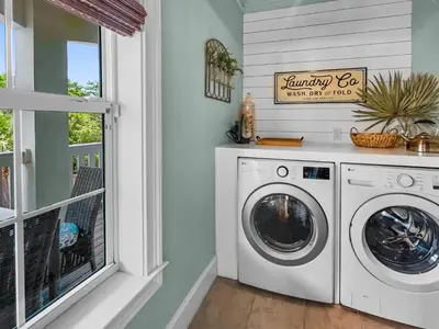 a laundry room with a washer and dryer at Sand Seair l Private Heated Pool l Bikes and Golf Cart included in Inlet Beach