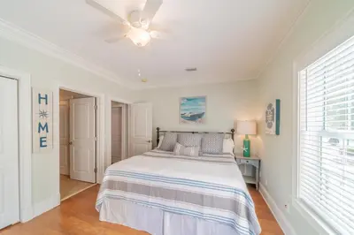 a bedroom with a bed and a ceiling fan at Sand Seair l Private Heated Pool l Bikes and Golf Cart included in Inlet Beach