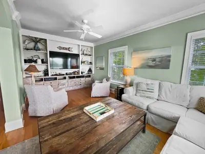 a living room with a couch and a coffee table at Sand Seair l Private Heated Pool l Bikes and Golf Cart included in Inlet Beach