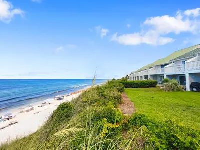 a house on the beach next to the ocean at Seacrest 6 l Beachfront l Bike to Alys and Rosemary Beach in Seacrest