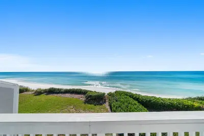 a view of the ocean from a balcony at Seacrest 8 l Beachfront l Bike to Alys and Rosemary Beach in Seacrest
