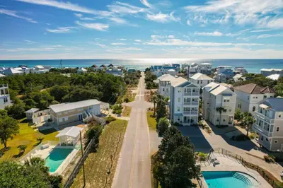 an aerial view of a city with houses and the ocean at Someday Came l 4 Bikes and Beach Towels l Community Pool in Inlet Beach