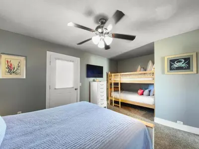 a bedroom with a bed and a ceiling fan at Shoreline Townhomes 10 l Steps to the Beach l Beautiful views from 2nd and 3rd balconies in Inlet Beach