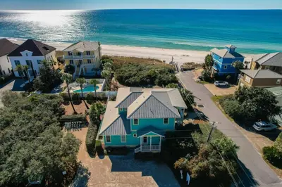 an aerial view of a house and the beach at Surfer Dog l Beachfront Pool l Includes Beach Chairs and Bikes in Inlet Beach