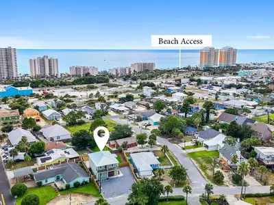 an aerial view of a residential suburb with a beach area at PCB Luxe 4BR, Heated Pool, 3 Blks to Beach in Panama City Beach