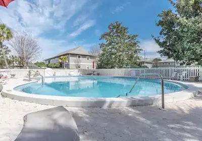 a large swimming pool with a fence around it at One Bedroom at Beachwood Villas on 30a in Seagrove, Florida in Santa Rosa Beach