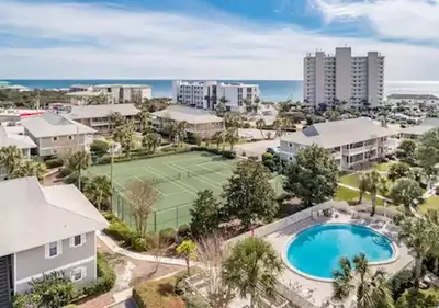 an aerial view of a tennis court and a tennis courtsktop at One Bedroom at Beachwood Villas on 30a in Seagrove, Florida in Santa Rosa Beach