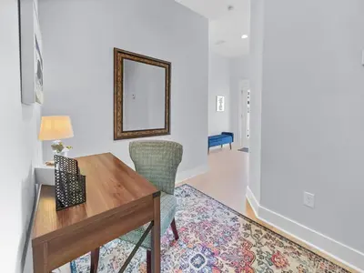 a dining room with a table and a mirror at The Way of Water l Community Pool l 2 Bikes included in Inlet Beach