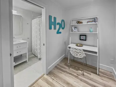 a small room with a desk and a chair at Three Steps to the Beach l Beachfront l Steps To The Beach l Includes 2 Bikes in Inlet Beach