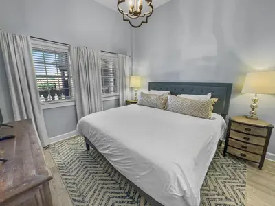 a bedroom with a large white bed and a window at Twickenham l Heated Community Pool l Private Balcony l Close to Rosemary in Rosemary Beach