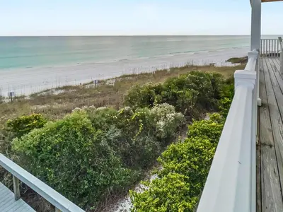 a view of the beach from the porch at Turtle Watch l Beachfront Pool l Includes Bikes and Beach Chair in Inlet Beach