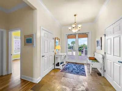 a home office with a white door and a desk at Turtle Watch l Beachfront Pool l Includes Bikes and Beach Chair in Inlet Beach
