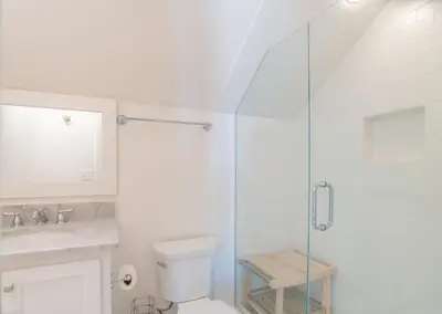 a bathroom with a toilet and a glass shower at Young Haven l Community Pool l Great Beach house Next to Seaside in Santa Rosa Beach