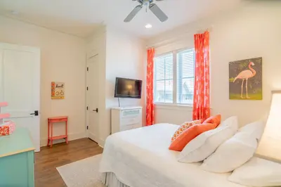 a bedroom with a bed and a tv at Young Haven l Community Pool l Great Beach house Next to Seaside in Santa Rosa Beach