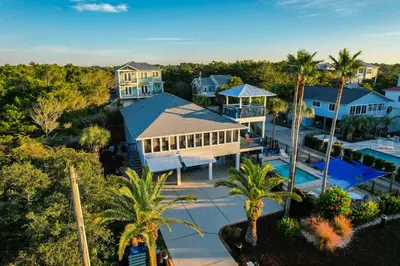 an aerial view of a house with a pool and palm trees at Lagerheads l Beach Views l Private Pool l Dog Friendly l Includes 4 Bikes in Inlet Beach
