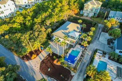 an aerial view of a house with palm trees at Lagerheads l Beach Views l Private Pool l Dog Friendly l Includes 4 Bikes in Inlet Beach