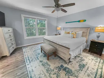 a bedroom with a bed and a ceiling fan at Lagerheads l Beach Views l Private Pool l Dog Friendly l Includes 4 Bikes in Inlet Beach