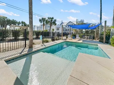 a swimming pool with a hammock in a house at Lagerheads l Beach Views l Private Pool l Dog Friendly l Includes 4 Bikes in Inlet Beach