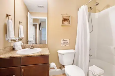 a bathroom with a toilet and a sink and a shower at Laketown Wharf 531 in Panama City Beach