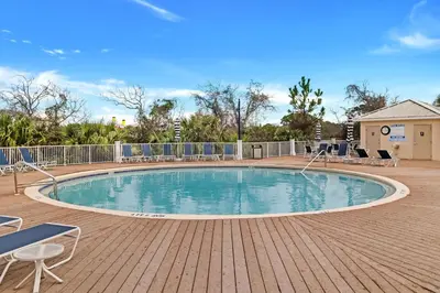 a large swimming pool with chairs around it at Laketown Wharf 531 in Panama City Beach