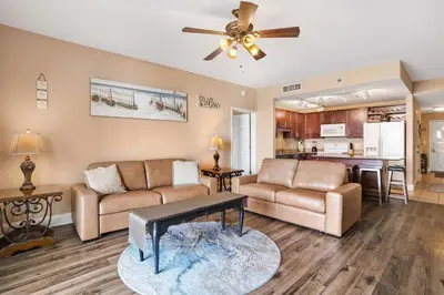 a living room with a couch and a table at Laketown Wharf 531 in Panama City Beach