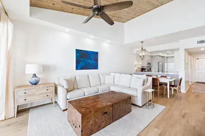 a living room with a couch and a table at HP 42W Peaceful Nest by 30A Escapes in Rosemary Beach