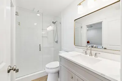 a white bathroom with a sink and a shower at HP 42W Peaceful Nest by 30A Escapes in Rosemary Beach
